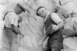Archive - 2 men using dynamite in clay pit