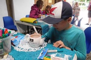 boy doing pottery painting